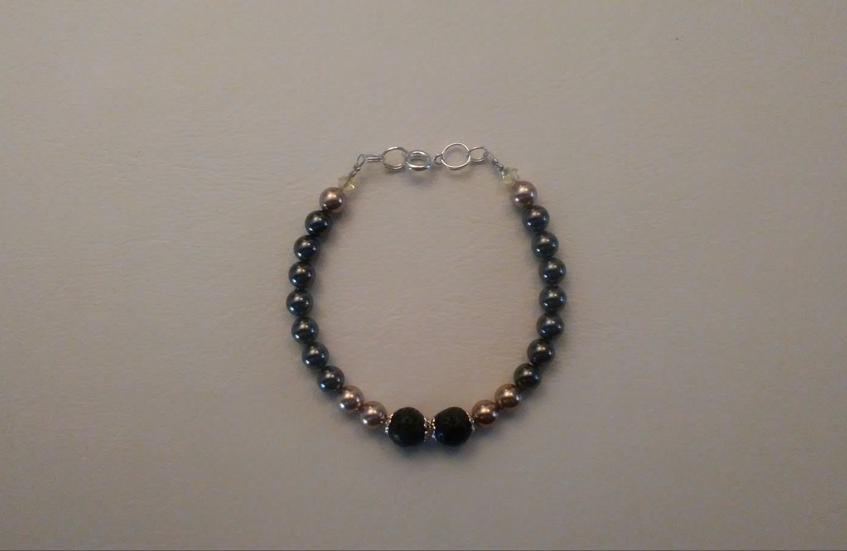 A lava stone and pearl diffuser bracelet.